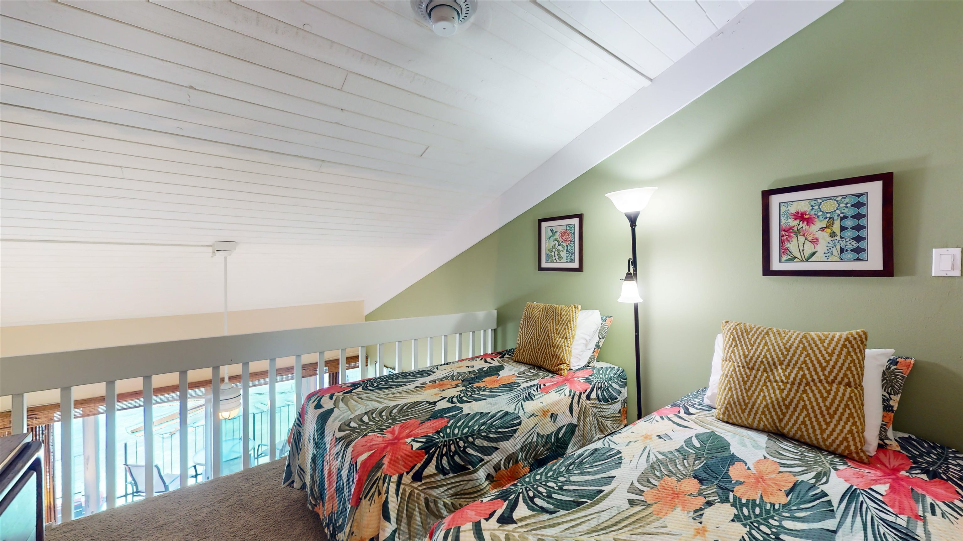 5255 Lower Honoapiilani Road, Unit 219 Lahaina, HI 96761 - Photo 9 of 12 a bedroom with bed and a painting on the wall