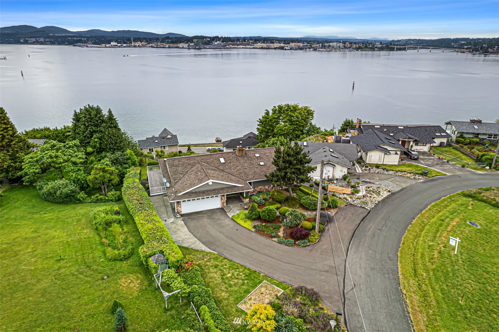 an aerial view of a house with a lake view