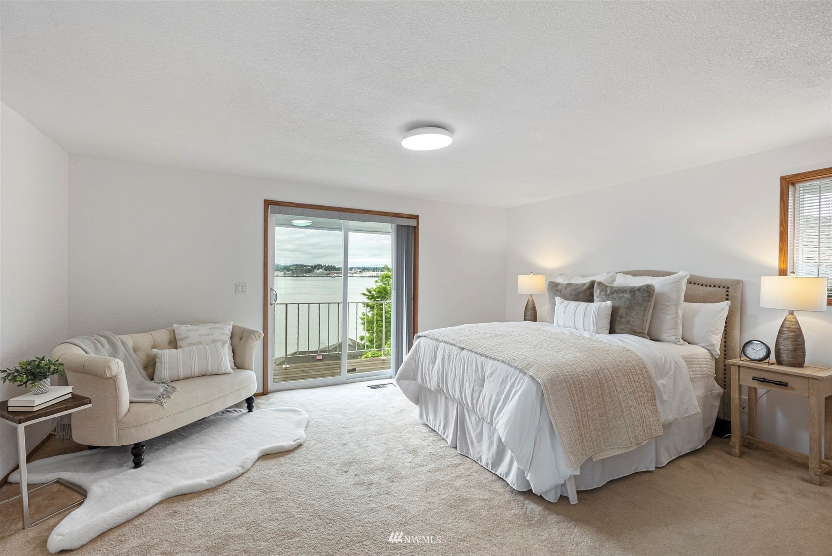 3891 Rama Drive East Port Orchard, WA 98366 - Photo 15 of 32 a bedroom with a bed and a couch