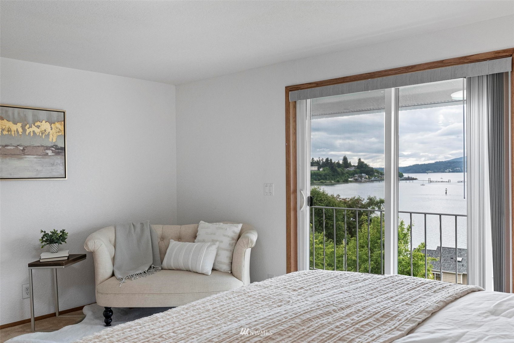 3891 Rama Drive East Port Orchard, WA 98366 - Photo 16 of 32 a bedroom with a large bed and a window