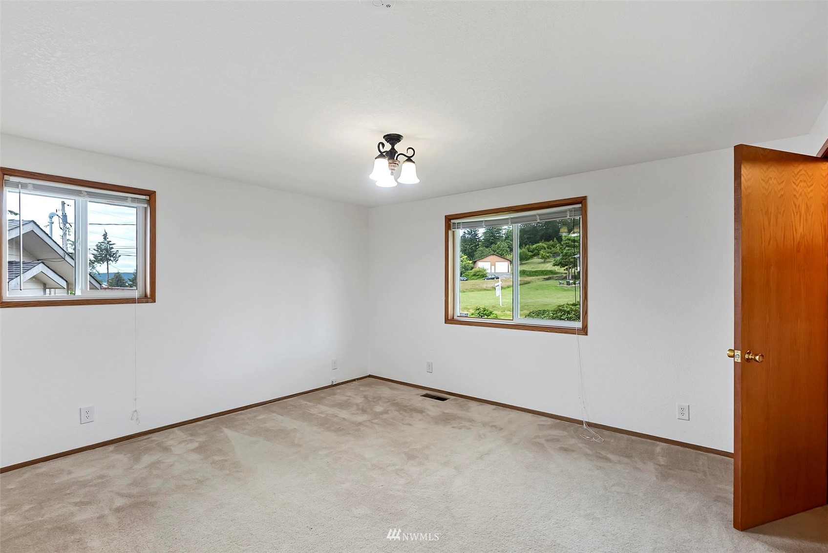 3891 Rama Drive East Port Orchard, WA 98366 - Photo 19 of 32 a view of an empty room with a window