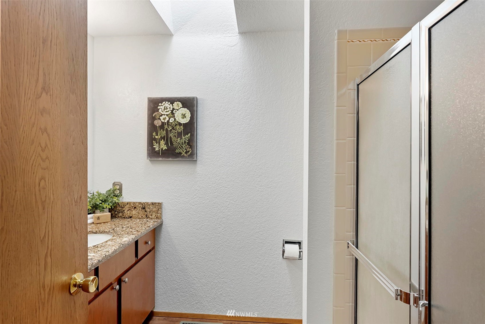 3891 Rama Drive East Port Orchard, WA 98366 - Photo 20 of 32 a bathroom with a granite countertop sink and a mirror
