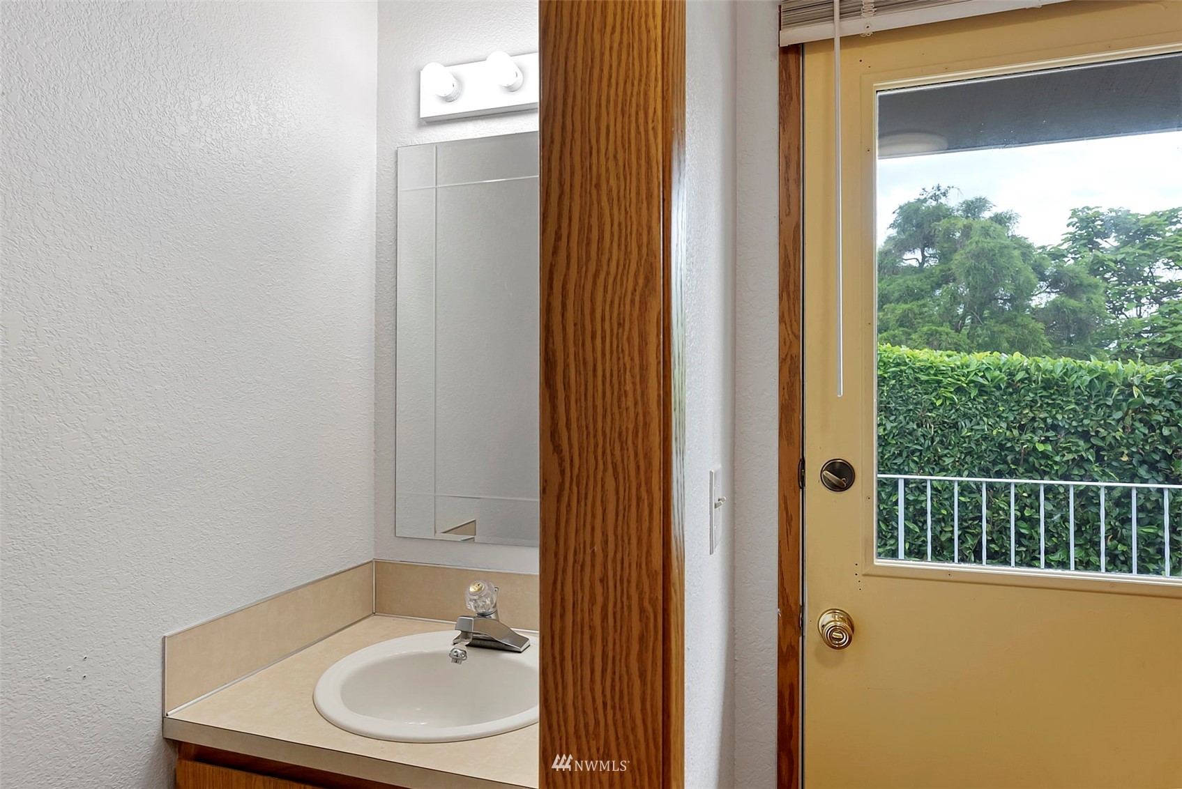 3891 Rama Drive East Port Orchard, WA 98366 - Photo 23 of 32 a bathroom with a sink and a mirror