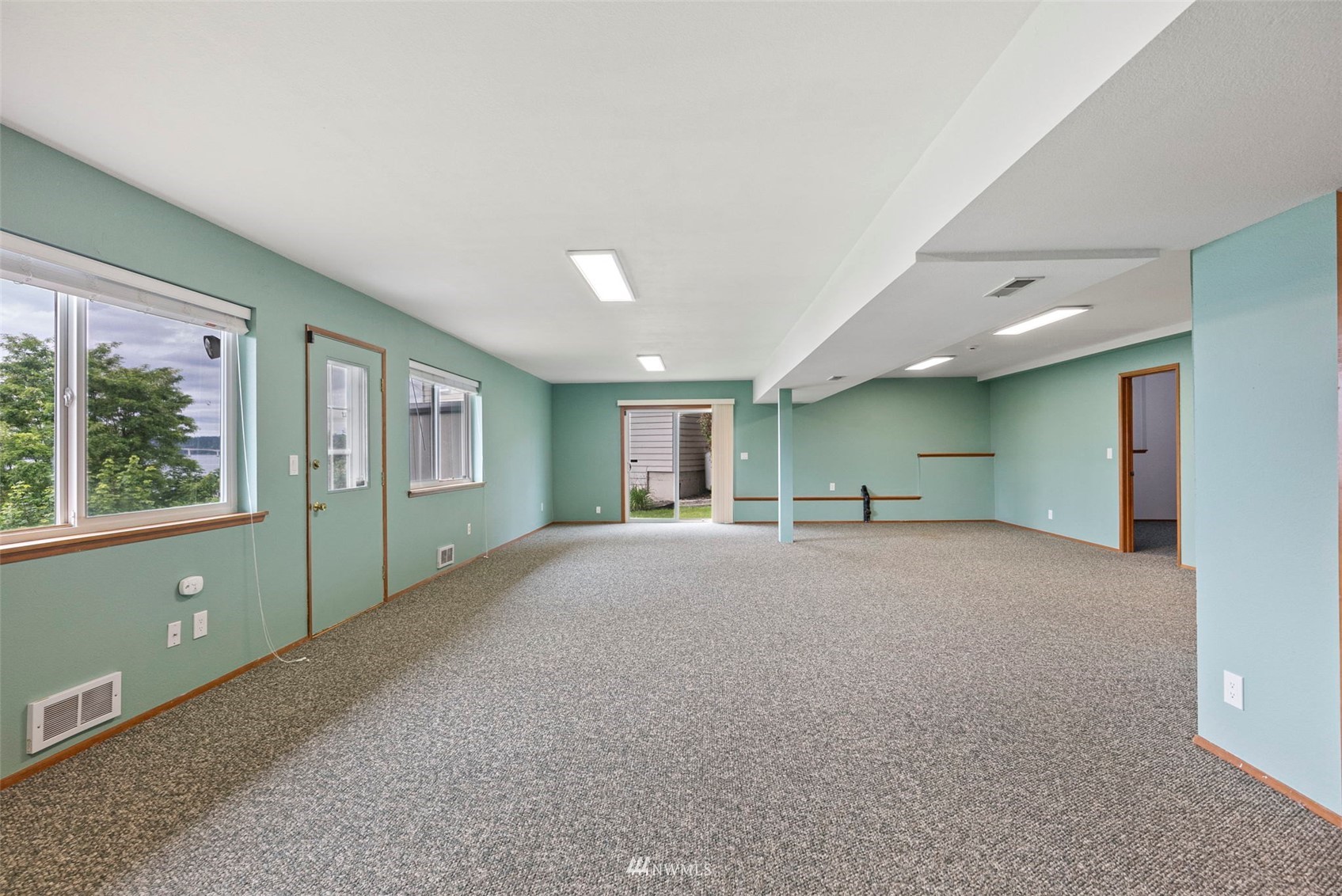 3891 Rama Drive East Port Orchard, WA 98366 - Photo 24 of 32 a view of a livingroom with a window and a kitchen