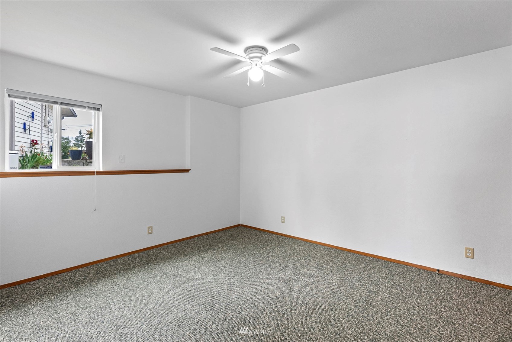 3891 Rama Drive East Port Orchard, WA 98366 - Photo 27 of 32 an empty room with a window and a ceiling fan