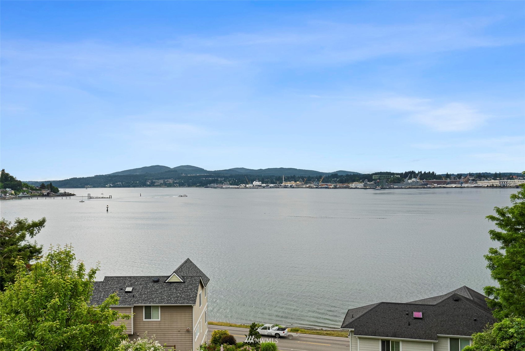 3891 Rama Drive East Port Orchard, WA 98366 - Photo 32 of 32 a view of a lake with houses in front of it