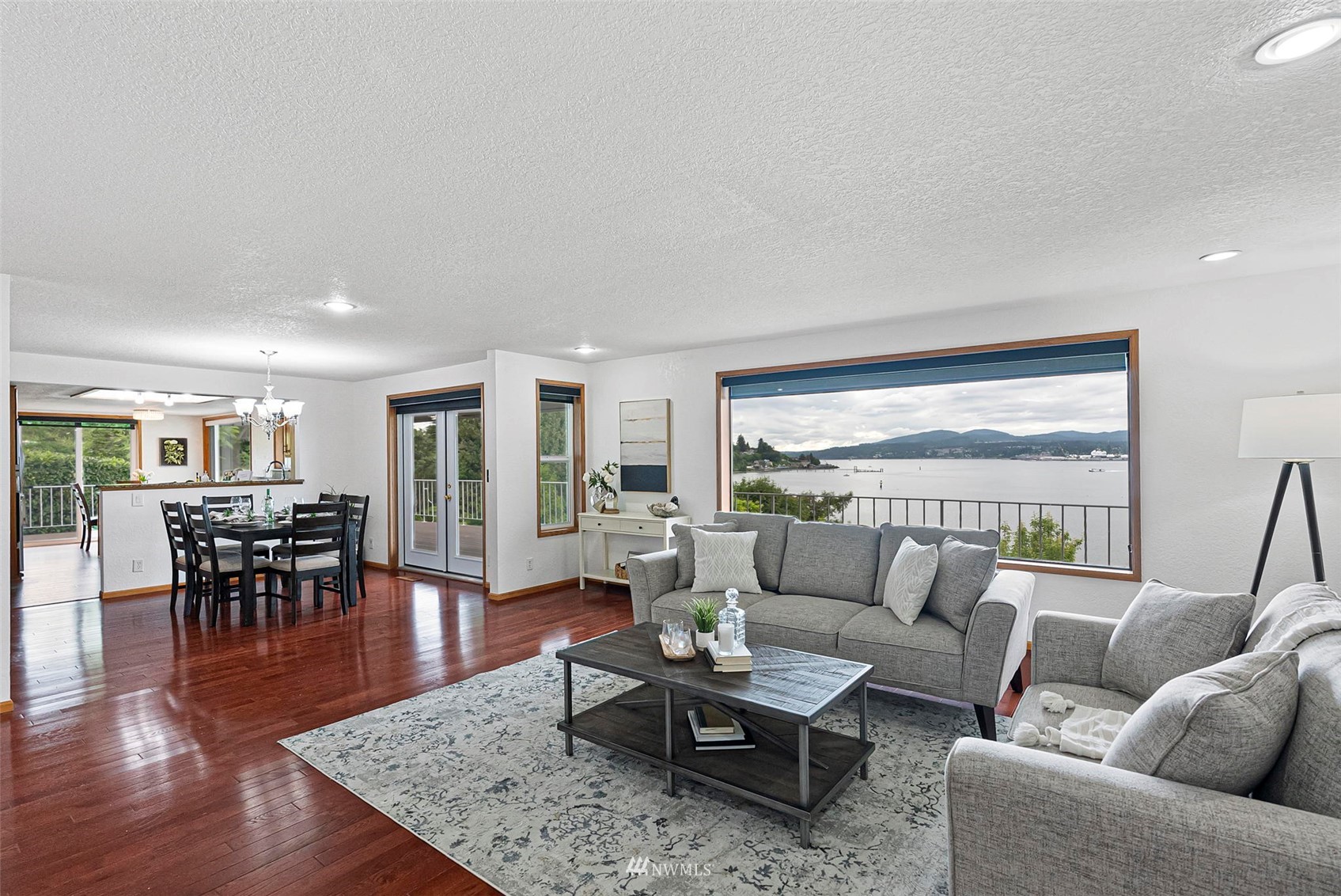 3891 Rama Drive East Port Orchard, WA 98366 - Photo 6 of 32 a living room with furniture wooden floor and a table