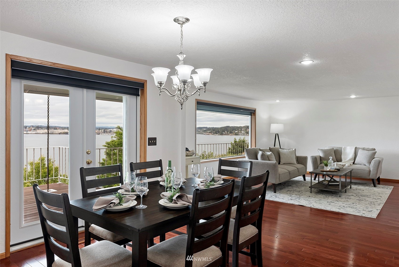 3891 Rama Drive East Port Orchard, WA 98366 - Photo 8 of 32 a view of a dining room with furniture wooden floor and chandelier