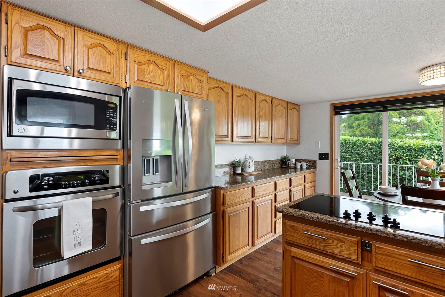 3891 Rama Drive East Port Orchard, WA 98366 - Photo 10 of 32 a kitchen with stainless steel appliances granite countertop a refrigerator stove and sink
