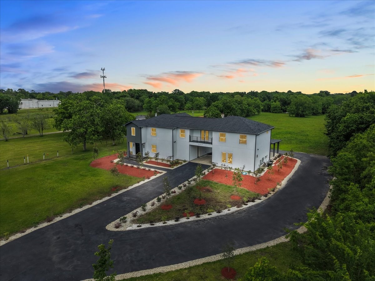Welcome to 3237 Harkey Rd! Modern custom estate with gated entry on expansive acreage.