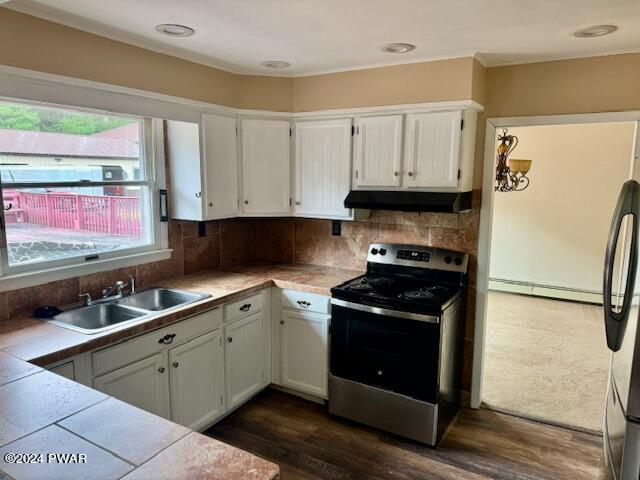 164 Tuthill Road Waymart, PA 18472 - Photo 12 of 33 a kitchen with stainless steel appliances granite countertop a stove a refrigerator and a sink