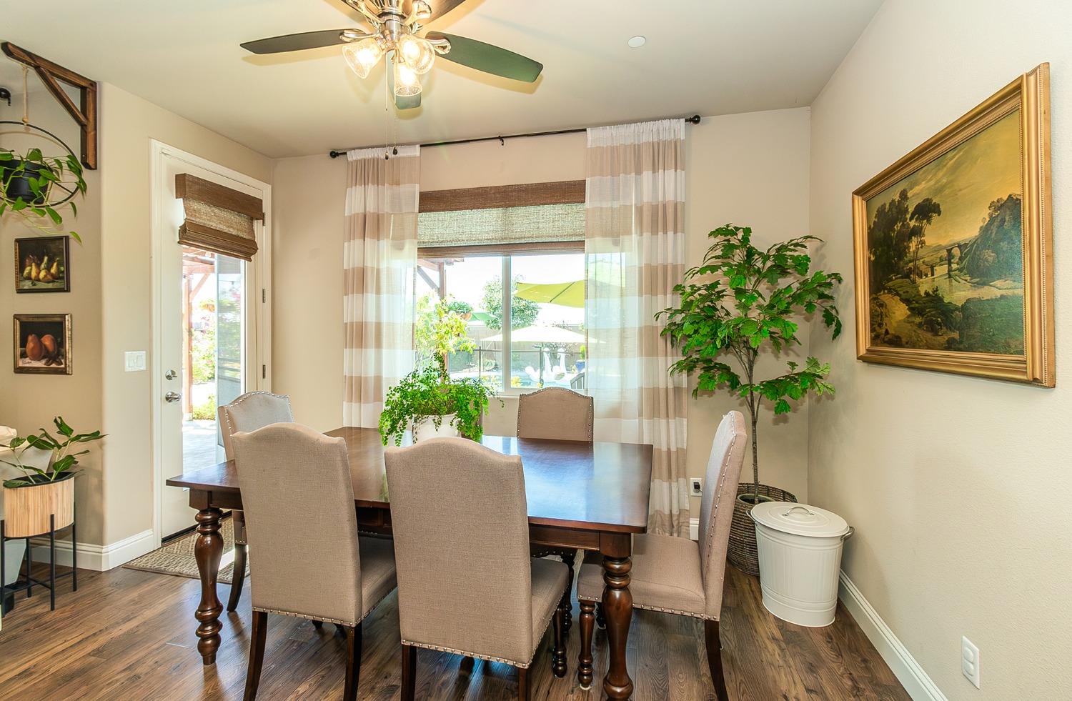 2716 Pontiac Avenue Clovis, CA 93611 - Photo 15 of 32 a view of a dining room with furniture window and wooden floor