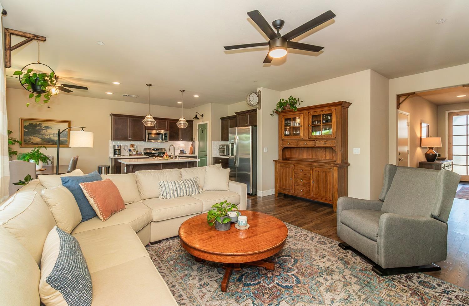 2716 Pontiac Avenue Clovis, CA 93611 - Photo 10 of 32 a living room with furniture and a view of kitchen