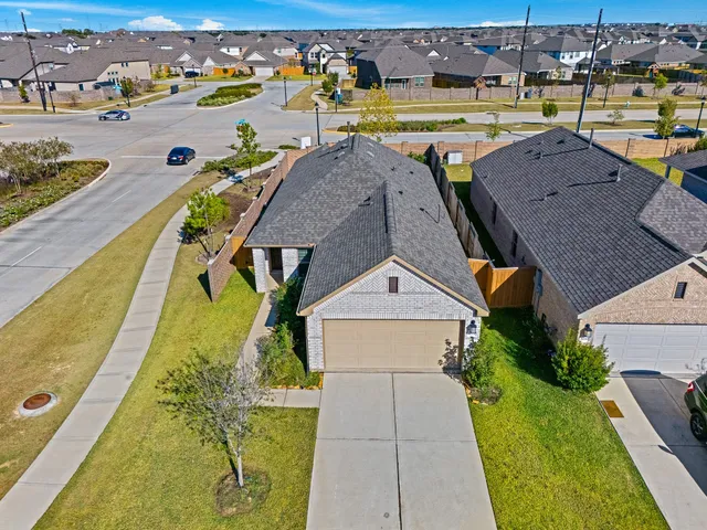 an aerial view of a house with swimming pool