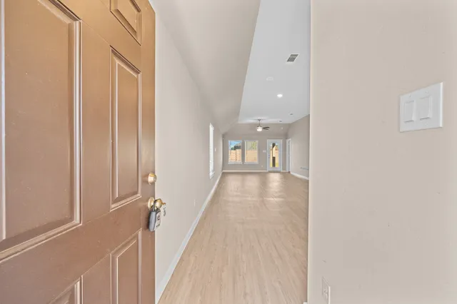 a view of a hallway with a white walls
