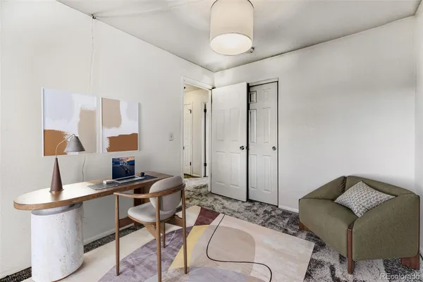 a view of an empty room with windows