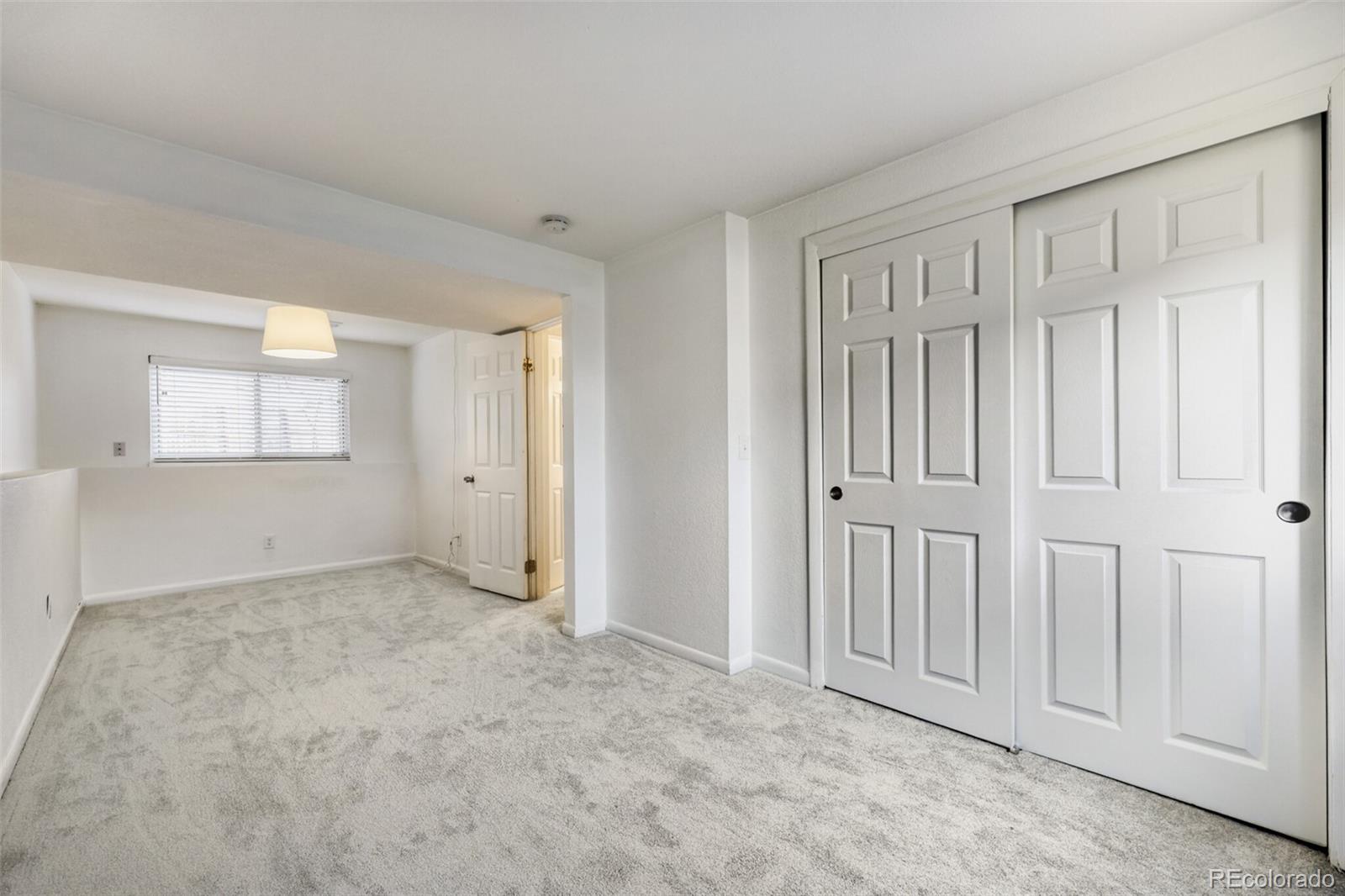 9168 Flower Court Westminster, CO 80021 - Photo 27 of 38 an empty room with windows