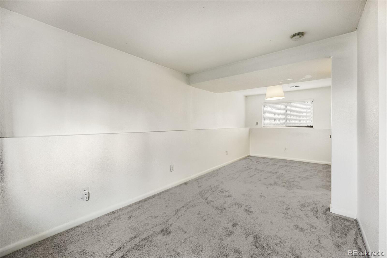 9168 Flower Court Westminster, CO 80021 - Photo 28 of 38 a view of a room with an empty space