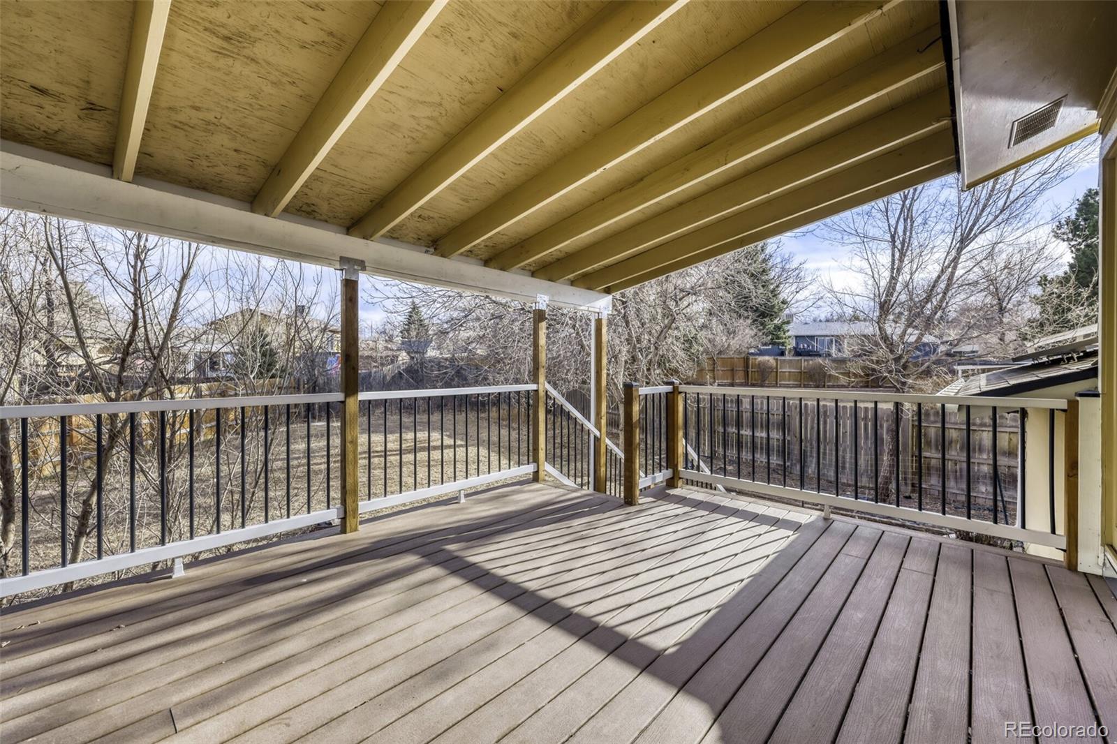 9168 Flower Court Westminster, CO 80021 - Photo 32 of 38 a view of balcony with wooden floor