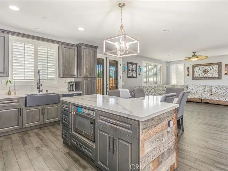 15851 Sulphur Springs Road Moreno Valley, CA 92555 - Photo 15 of 47 a kitchen with stainless steel appliances granite countertop a sink stove and refrigerator