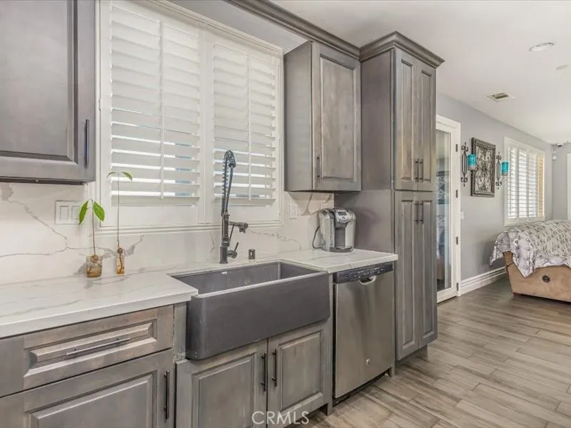 15851 Sulphur Springs Road Moreno Valley, CA 92555 - Photo 16 of 47 a kitchen with a sink and cabinets