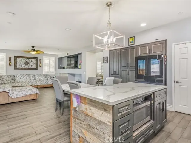 a view of a dining room with furniture wooden floor and chandelier