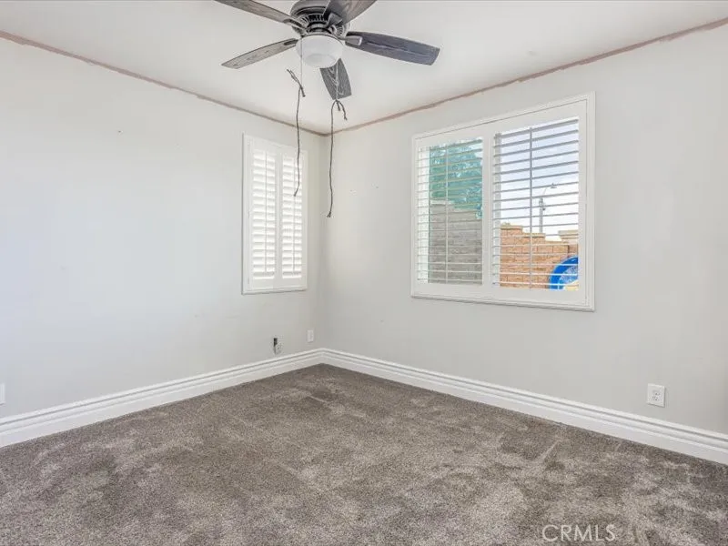 15851 Sulphur Springs Road Moreno Valley, CA 92555 - Photo 19 of 47 a view of an empty room with a window