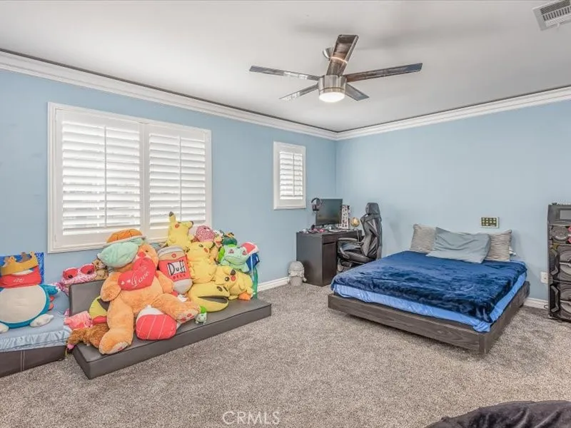 15851 Sulphur Springs Road Moreno Valley, CA 92555 - Photo 32 of 47 a bedroom with bed and window