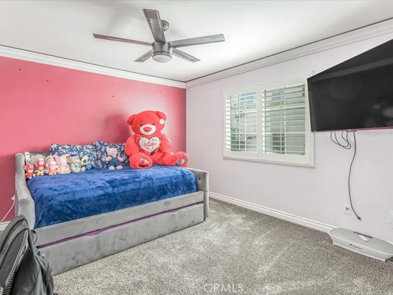 15851 Sulphur Springs Road Moreno Valley, CA 92555 - Photo 34 of 47 a bedroom with a bed and a flat screen tv