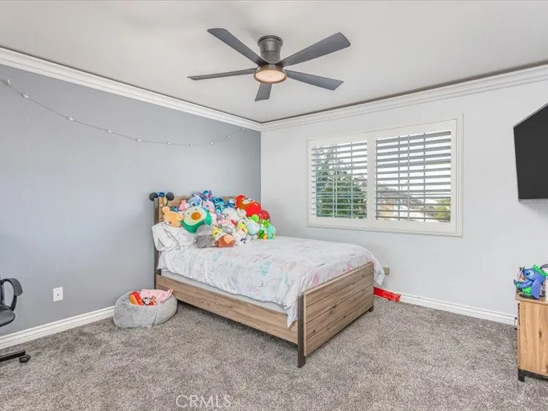 15851 Sulphur Springs Road Moreno Valley, CA 92555 - Photo 35 of 47 a bedroom with a bed and window