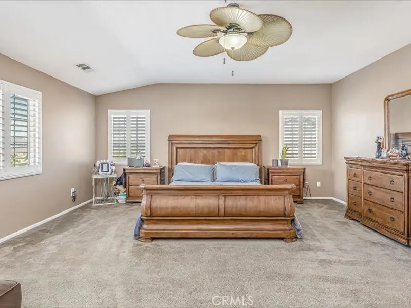 15851 Sulphur Springs Road Moreno Valley, CA 92555 - Photo 37 of 47 a spacious bedroom with a bed and window
