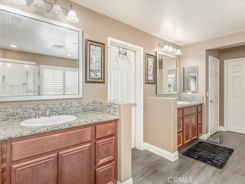 15851 Sulphur Springs Road Moreno Valley, CA 92555 - Photo 39 of 47 a bathroom with a sink double vanity and a mirror