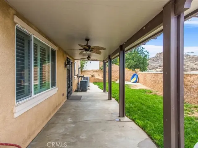 a view of a porch and garden