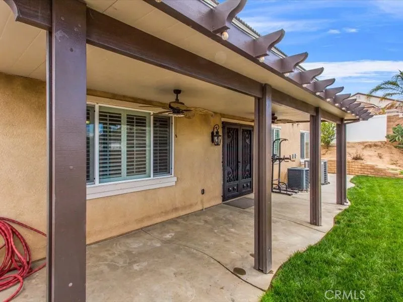 15851 Sulphur Springs Road Moreno Valley, CA 92555 - Photo 44 of 47 a view of house with backyard and porch