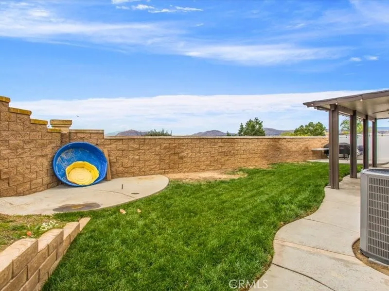 15851 Sulphur Springs Road Moreno Valley, CA 92555 - Photo 45 of 47 a view of a swimming pool with an outdoor seating