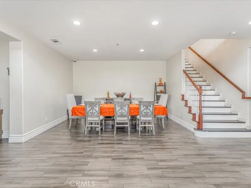 15851 Sulphur Springs Road Moreno Valley, CA 92555 - Photo 8 of 47 a group of people sitting on floor in a room