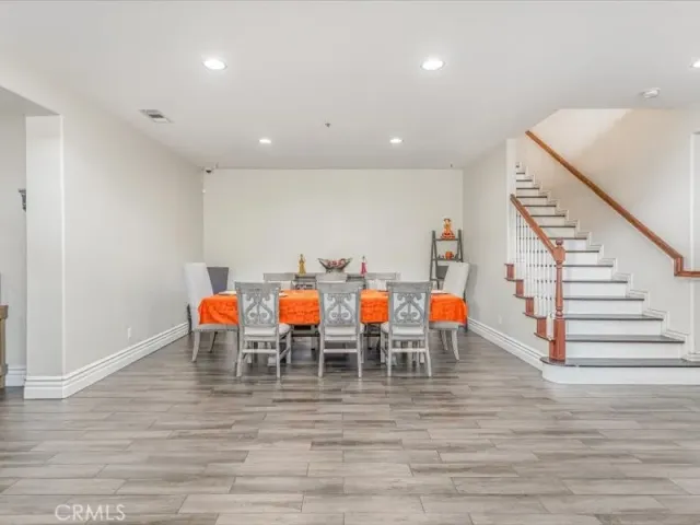 a group of people sitting on floor in a room