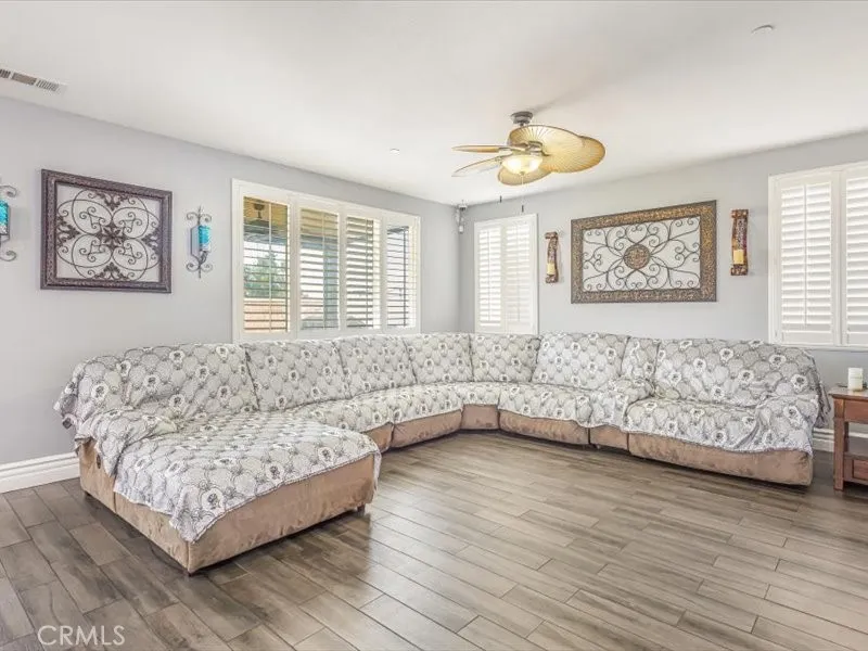 15851 Sulphur Springs Road Moreno Valley, CA 92555 - Photo 10 of 47 a living room with furniture and a large window