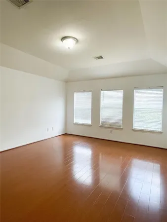 an empty room with a empty space and a window