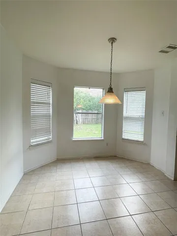 a bathroom with a sink a mirror and a window