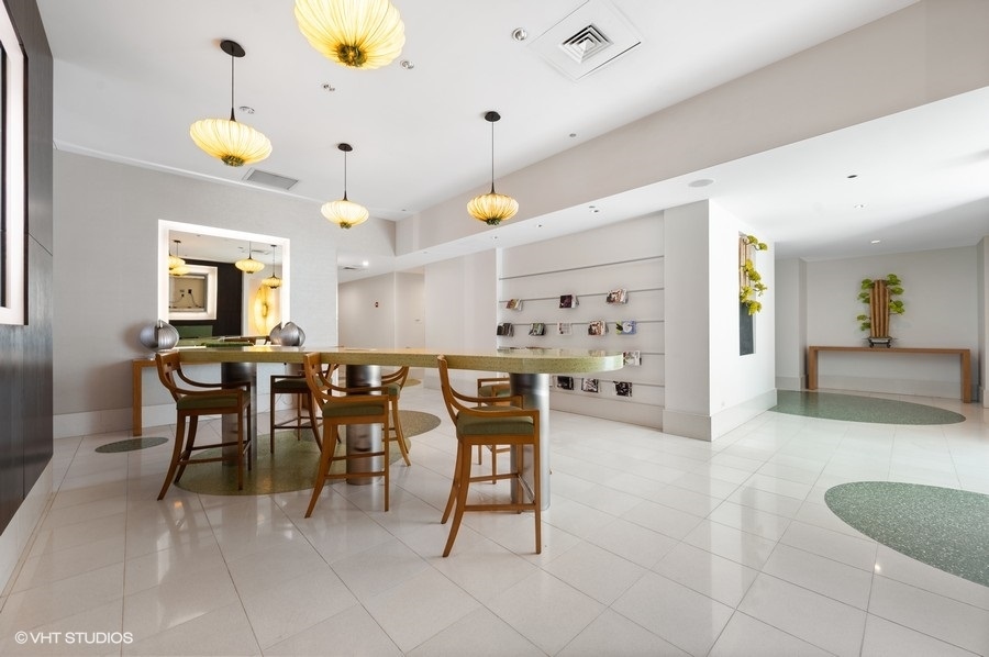 123 South Green Street, Unit 201B Chicago, IL 60607 - Photo 19 of 19 a view of kitchen with furniture and chandelier