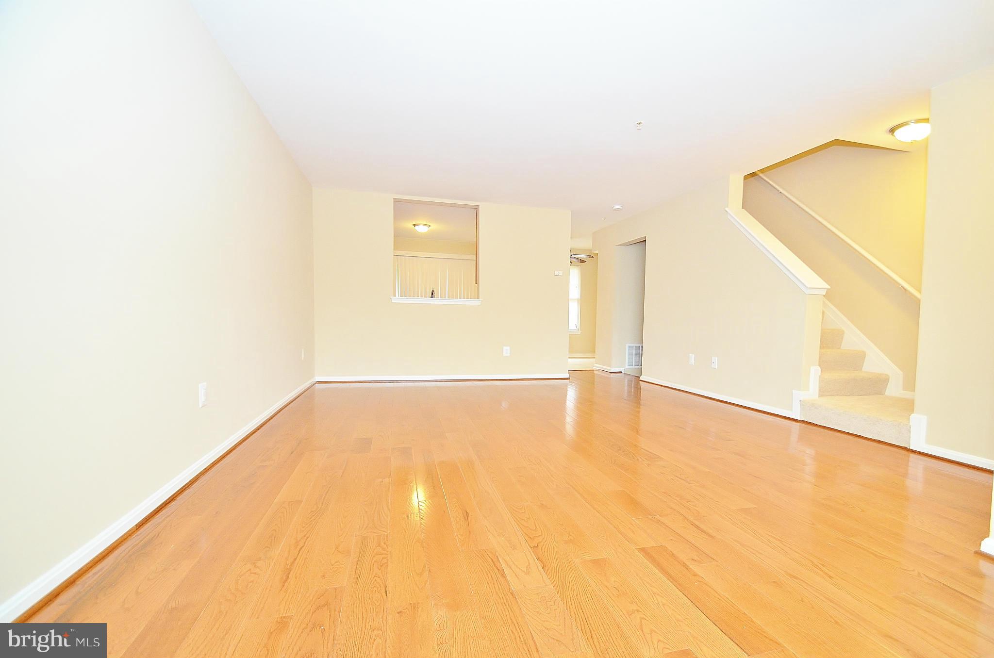 1331 Hazel Street Baltimore, MD 21226 - Photo 4 of 19 a view of empty room with wooden floor