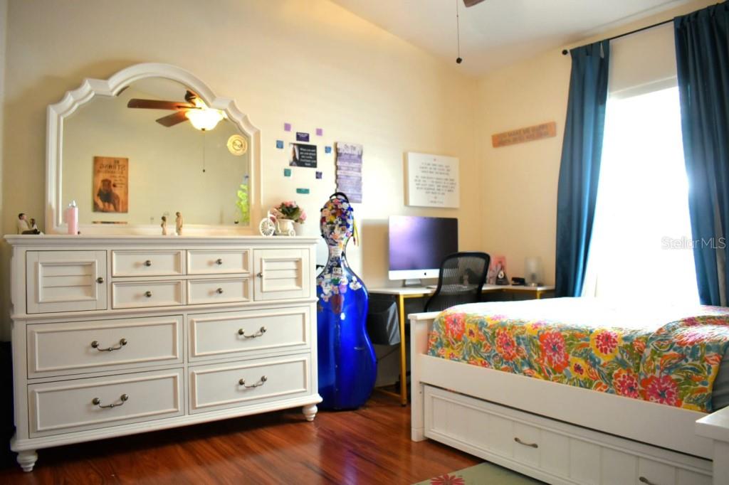 13541 Tetherline Trail Orlando, FL 32837 - Photo 25 of 39 a bedroom with a bed and with furniture