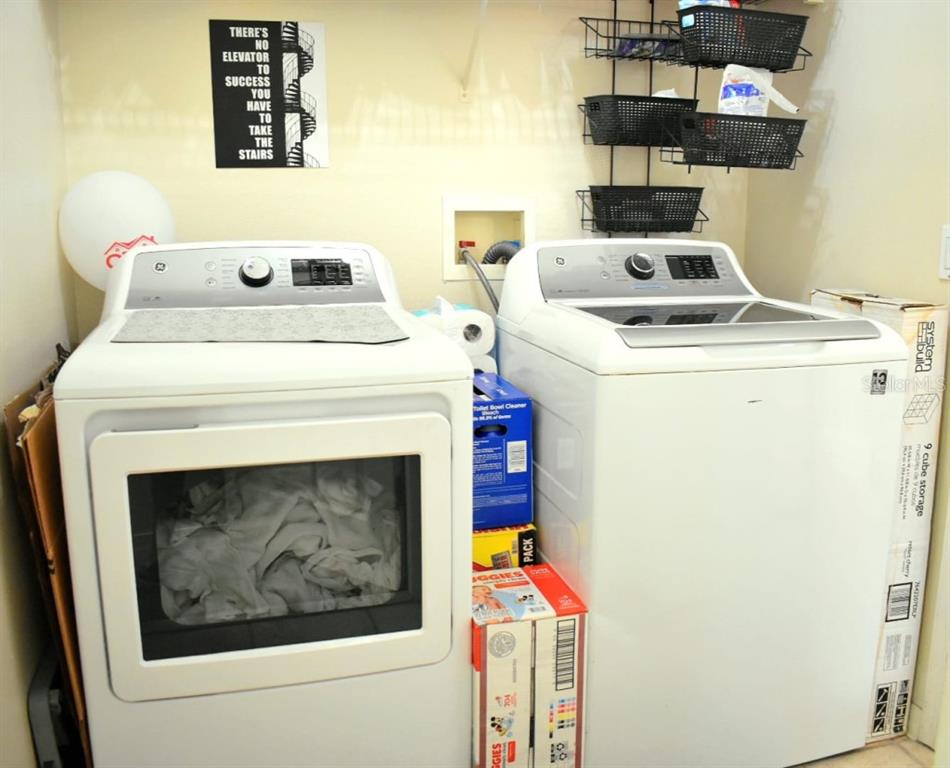 13541 Tetherline Trail Orlando, FL 32837 - Photo 29 of 39 a utility room with dryer and washer