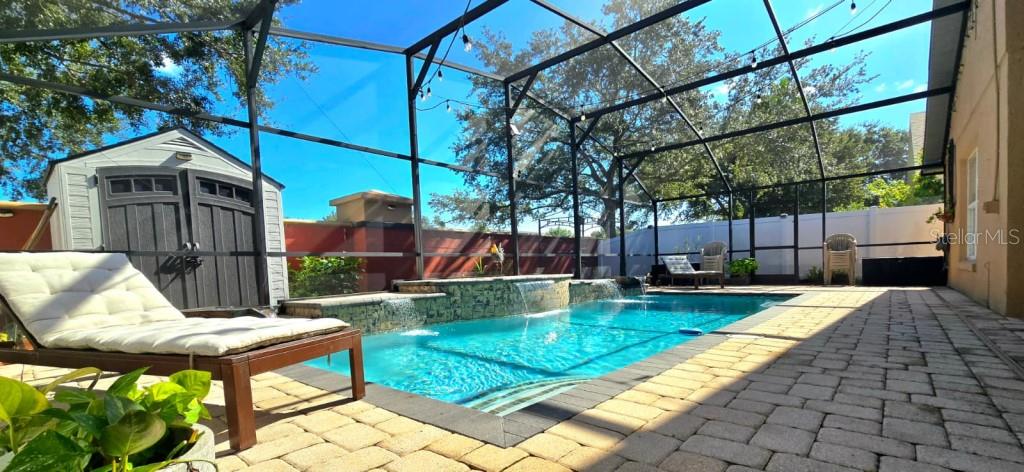 13541 Tetherline Trail Orlando, FL 32837 - Photo 3 of 39 a view of backyard with swimming pool and seating