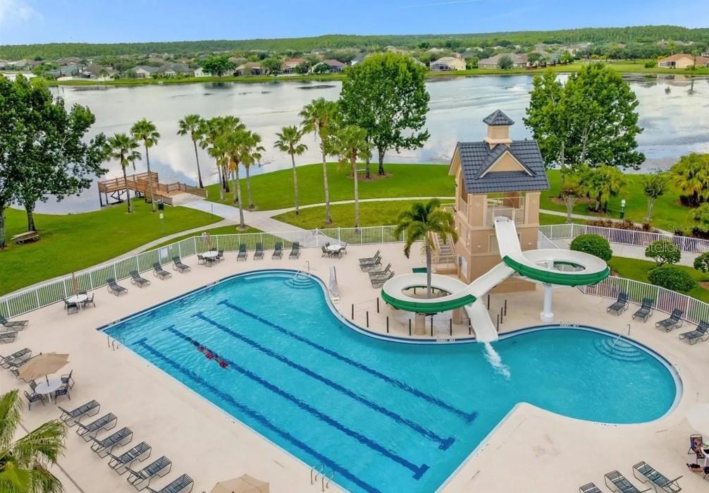 13541 Tetherline Trail Orlando, FL 32837 - Photo 32 of 39 a view of a swimming pool with lounge chairs