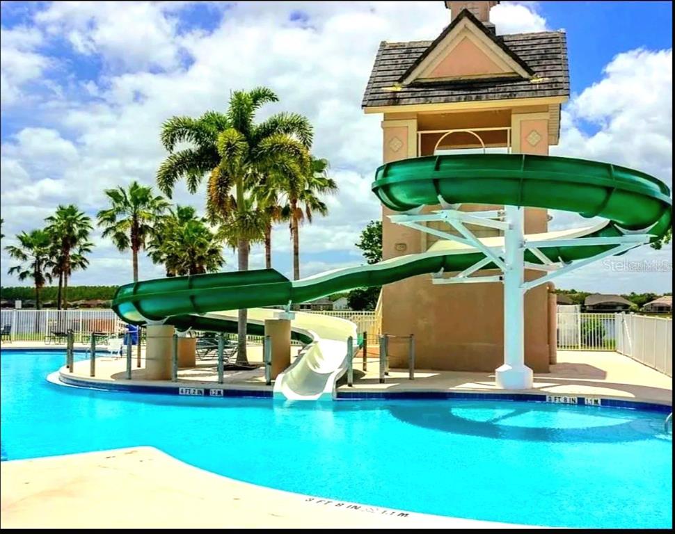 13541 Tetherline Trail Orlando, FL 32837 - Photo 38 of 39 a view of a house with swimming pool