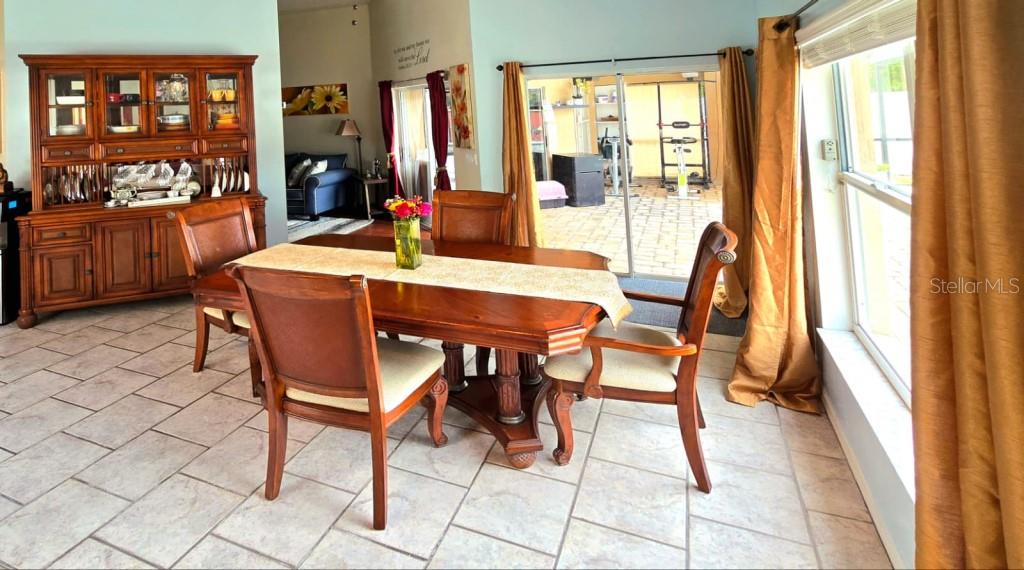 13541 Tetherline Trail Orlando, FL 32837 - Photo 9 of 39 a dining room with furniture and window