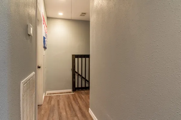 a view of entryway with wooden floor