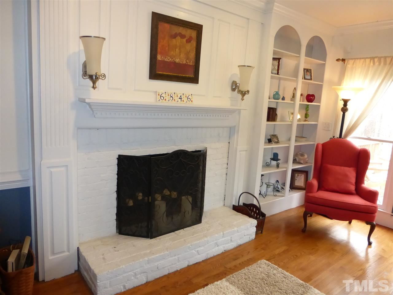 6846 Gloucester Road Raleigh, NC 27612 - Photo 8 of 18 a living room with furniture and a fireplace